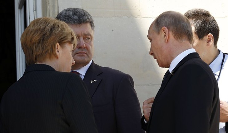 Poutine, Merkel, Hollande et Porochenko ont discuté de l’Ukraine - ảnh 1